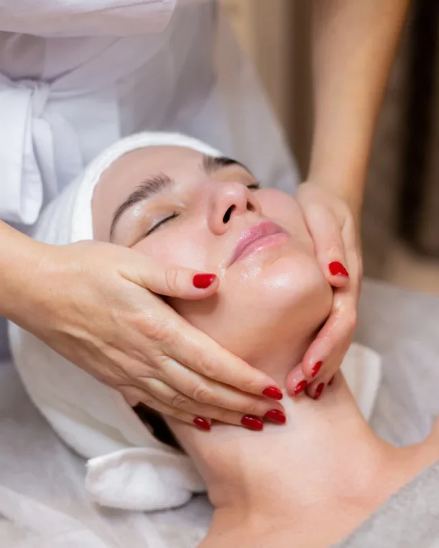 Woman receiving a facial massage to smooth fine lines and wrinkles