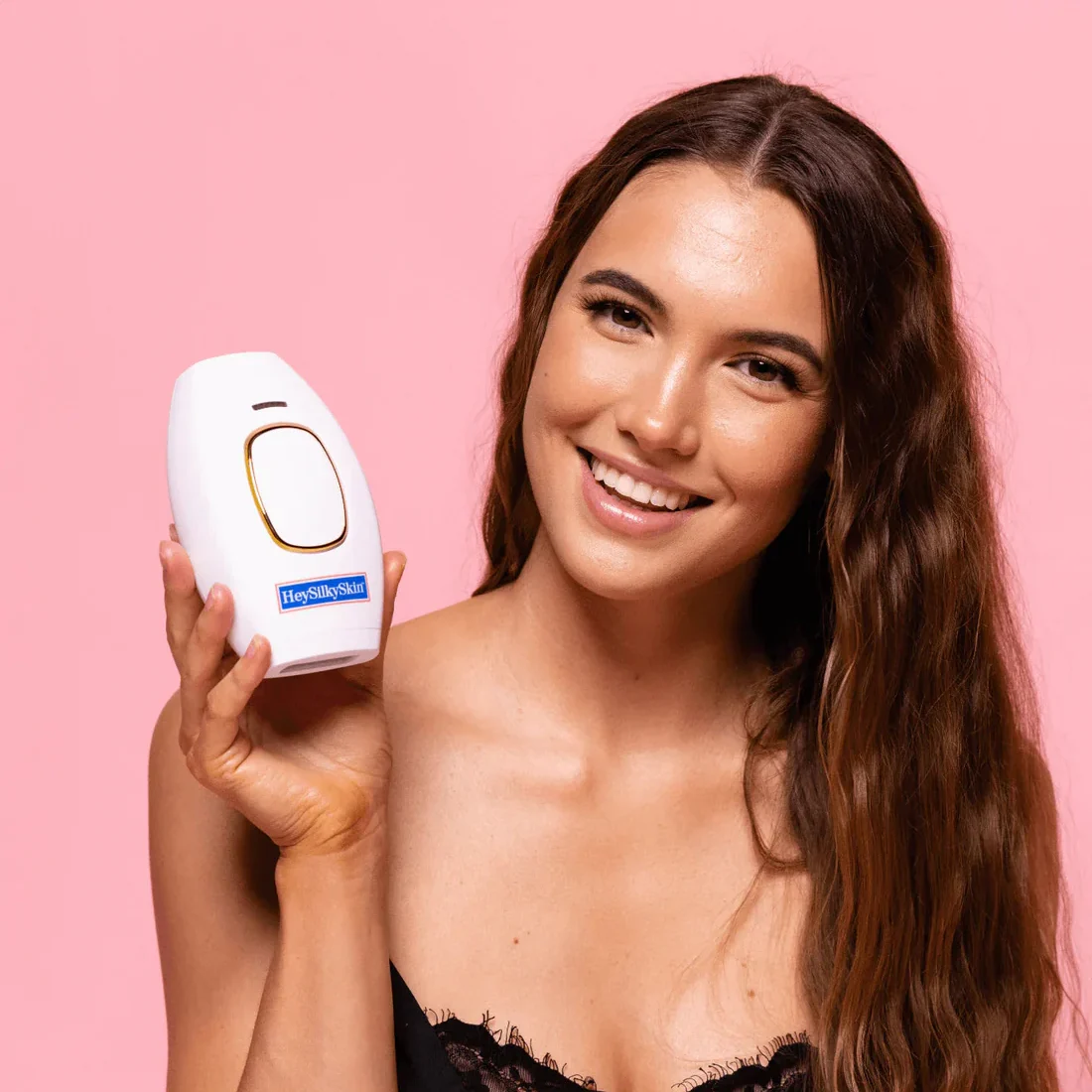 IPL laser hair removal handset by HeySilkySkin, held in hand to show its size and grip.
