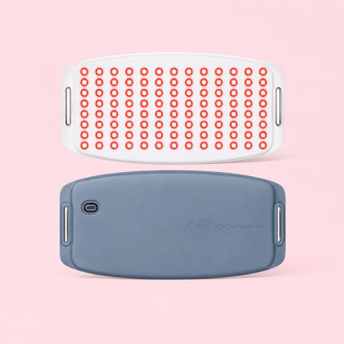 Portable red light therapy belt by HeySilkySkin, shown against a soft pink studio background.