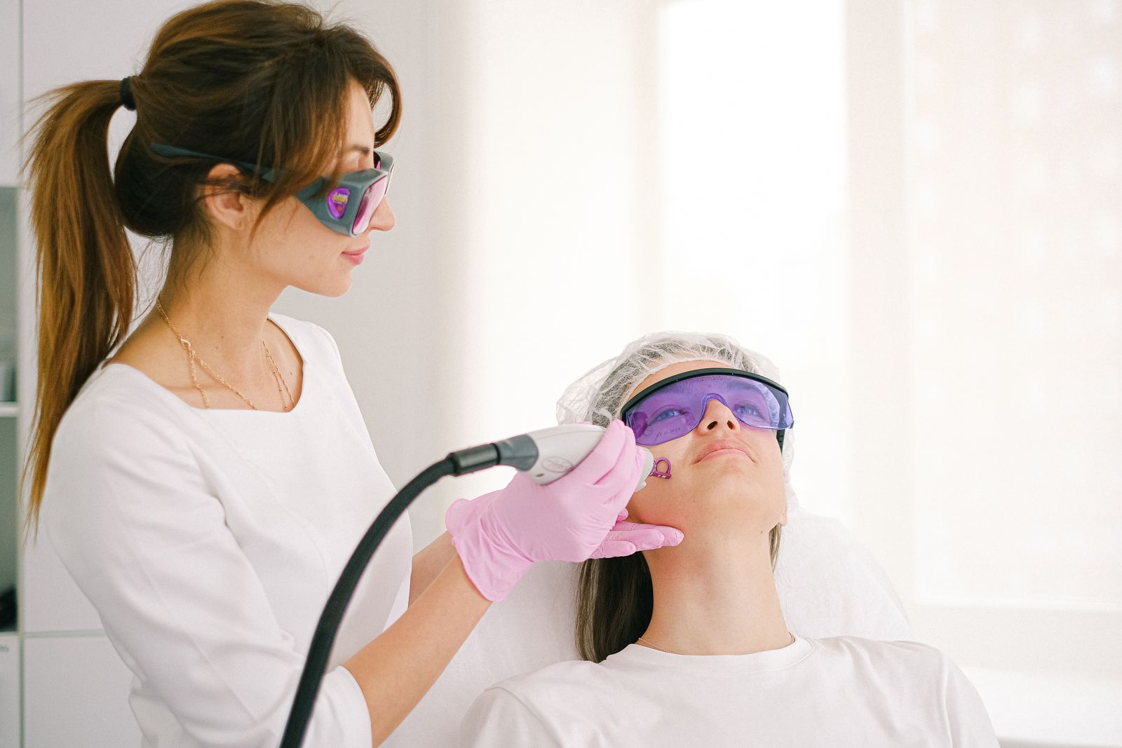 Electrolysis vs laser hair removal compared during a clinic facial treatment session